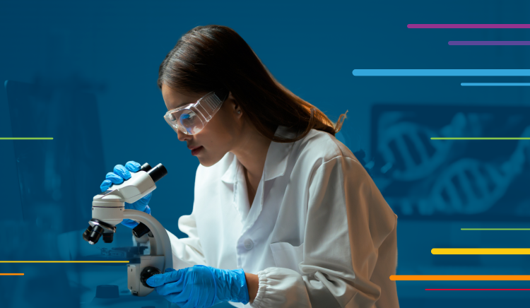 Scientist in lab coat and gloves examining a sample with a microscope.